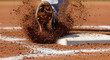 © IllustrationAlchemy - Baseball player sliding into home plate and kicking up dirt.