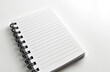 © Vadym - A blank spiral notebook with lined pages rests on a clean white surface. Its open pages invite writing, drawing, or planning. This minimalist stationery item is ready for creative ideas.