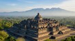 © Tri - Majestic Borobudur Temple at Sunrise, Surrounded by Misty Mountains and Lush Jungle in Java, Indonesia