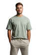 © PP Creative - A young man wearing a light green tshirt and beige sweatpants, standing with his hands in his pockets, isolated on transparent background