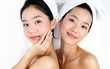 © wang - two Beautiful young asian woman with clean fresh skin on white background, Face care, Facial treatment, Cosmetology, beauty and spa, Asian women portrait. High quality