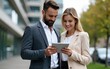 © lian - Handsome man and beautiful woman as business partners using digital tablet outdoor. High quality
