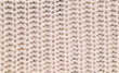© Levon - A close up of a knitted fabric with a white background