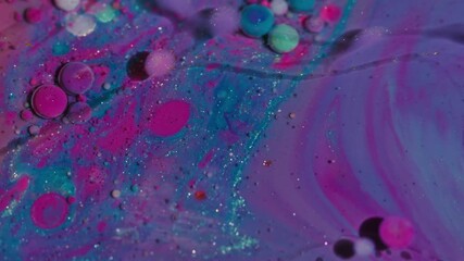 Wall Mural - Marble emulsion. Paint water. Defocused purple pink blue colorful droplet glitter oil acrylic liquid floating on abstract art background.