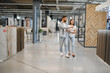 © Serhii - Couple shopping for home improvement tiles and flooring