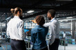 © DC Studio - Data center staff on industrial platform collaborating to maintain servers using artificial intelligence. Engineers doing teamwork to support infrastructure AI deep learning automatization.