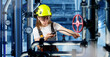 © Grispb - Female engineer in helmet and safety glasses inspecting industrial pipes with gauges and valves, concept of energy, engineering, maintenance. Activity: Industry, engineering.