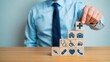 © shahabudin - Building better healthcare solutions with wooden blocks featuring symbols of hospitals, medicine, and patient care for innovative company strategies