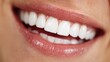 © EUT - Close-up photo of a person smiling, revealing very white and healthy teeth. Perfect for dental, beauty, or health-related marketing materials and advertisements.