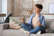 © Pixel-Shot - Cute boy meditating on sofa at home. Zen concept