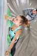 © auremar - wall climber trainer observing a student