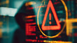 © Nattapol - Mysterious hacker initiates cyber attack. red warning alert symbol appears on system hologram, signaling dangerous cybersecurity threat