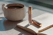 © Maria - Daily beauty and planning essentials displaying an open notebook, a pen, a cup of hot coffee, and a tube of liquid lip gloss, capturing a quiet start to the day