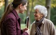 © cui - Young woman talking to a senior woman with a cane. High quality