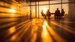 © rehan - Illuminated silhouettes of business professionals at a table during a meeting, bathed in warm sunlight from a large window with cityscape views.