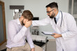 © fizkes - Empathetic male physician doctor comforts worried patient