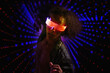 © VISTA by Westend61 - Virtual reality dancer in neon glasses illuminated at futuristic nightclub