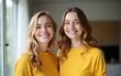 © si - Amazing blonde girl in yellow outfit chilling with best friend. Indoor full-length shot of two enthusiastic sisters smiling to camera. High quality