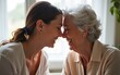 © li - Happy older mother and adult daughter touching foreheads close up, two generations expressing love and support, smiling young woman and mature mum, grandmother enjoying tender moment together at home