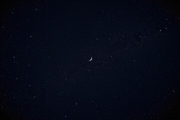 Wall Mural - Authentic night sky showcasing stars and a crescent moon
