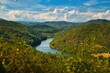 © AkuAku - River flowing through mountainous landscape
