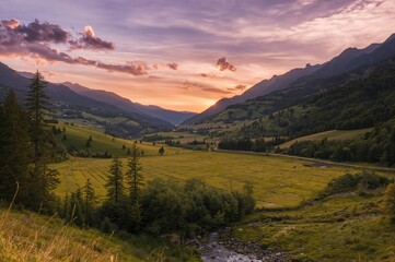Wall Mural - Sunrise over a mountain valley in summer