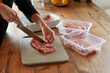 © EkaZehner - Preparing fresh pork meat for cooking on wooden table