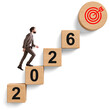 © ImageFlow - Businessman climbing wooden 2026 blocks arranged like stairs, isolated on white background, symbolizing progress, ambition, and business goal success