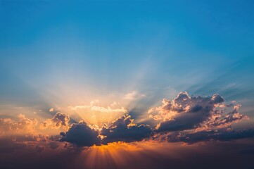 Wall Mural - Sunlight piercing through cloudy skies during a vibrant evening sunset.