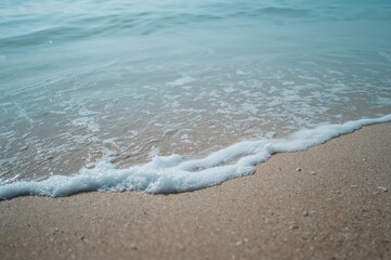Wall Mural - Gentle azure ripple over sandy surface, backdrop