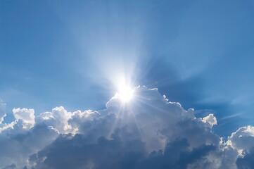 Wall Mural - Sun rays breaking through the clouds in a clear sky