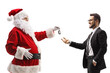 © Ljupco Smokovski - Santa claus giving car keys to a businessman