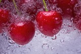 Close-Up of Bubbly Water with Juicy Red Cherries