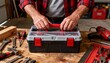 © Ksenia - Dad opening toolbox to repair in natural garage light with focused mood and detailed on workbench