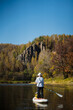 © Aleksey - Join us for an exhilarating Paddleboarding Adventure along a serene river, surrounded by vibrant autumn foliagea perfect mix of exploration and relaxation. Dont miss this experience