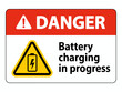 © Rina - Danger Sign Warning Battery Charging in Progress with Triangular Symbol on White Background and Prominent Red Header