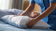 © Bagong - A nurse adjusts a pillow behind a patient in bed, providing comfort and support