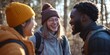 © Irina Ukrainets - Three friends share laughter in a winter forest. They wear warm hats and jackets as they enjoy the outdoors and each other’s company. This photo captures joy in a natural setting. AI