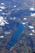 © ChiccoDodiFC - high angle view of a lake in the middle of the flat land and the white clouds