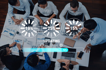 Wall Mural - A top-down view of a diverse team collaborating in a modern office setting with visual progress indicators showing project updates, enhancing productivity and creativity. Trope