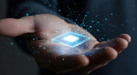 Man hand holding futuristic microchip with glowing light and particles. Concept of new technology and artificial intelligence development.