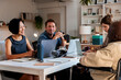 © Jovo Jovanovic/Stocksy - Diverse team collaborates at a modern office meeting table.