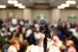 © Holly Clark/Stocksy - Closeup of a microphone at conference