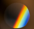 © koganami studio/Stocksy - Spectrum of rainbow light seen through round lens