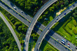 © Yic Ma/Stocksy - Aerial view of highway interchange with curved ramp