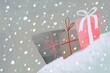 © Volha Kaliaha/Stocksy - Christmas Gift Boxes in Snowfall