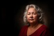 © Mariam - Elderly woman looking at camera with black background portrait with dramatic lighting