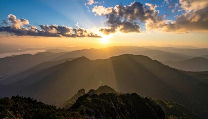 Wall Mural - Majestic sunrise over mountain ranges with rays of light illuminating the landscape, serene atmosphere