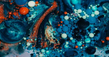 Wall Mural - Color bubbles. Oil fluid. Defocused blue orange purple ink glitter acrylic water shiny round texture floating on abstract art background.