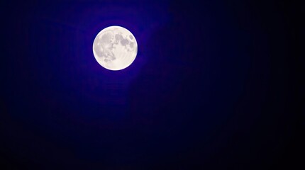 Wall Mural - Gentle, soft light illuminates a moon in deep ultraviolet hues with vivid purples, high contrast, diffused shadows, and subtle illumination